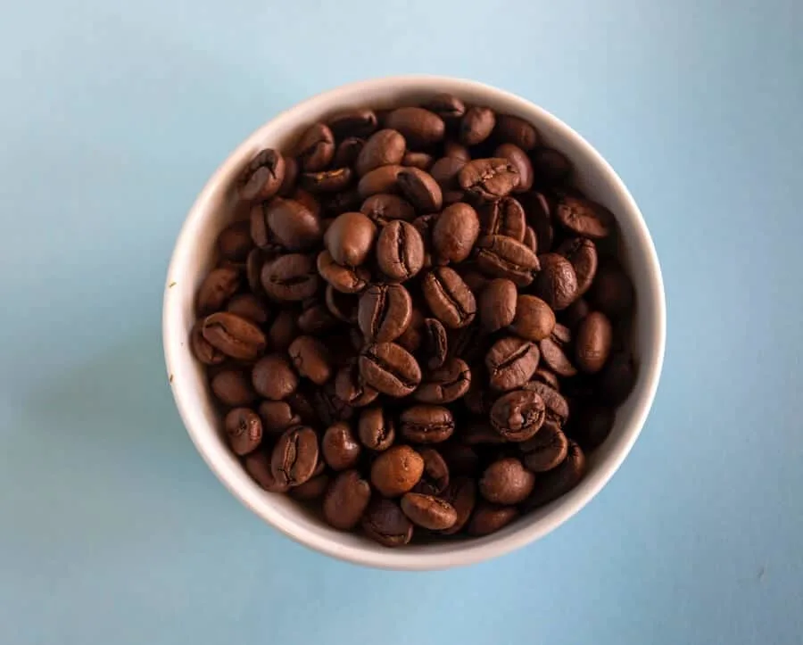 Coffee beans in a cup.