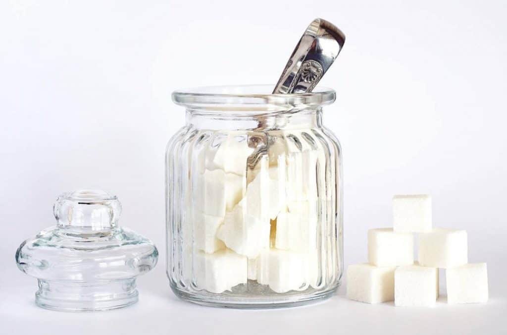 A picture of a jar filled with sugar cubes