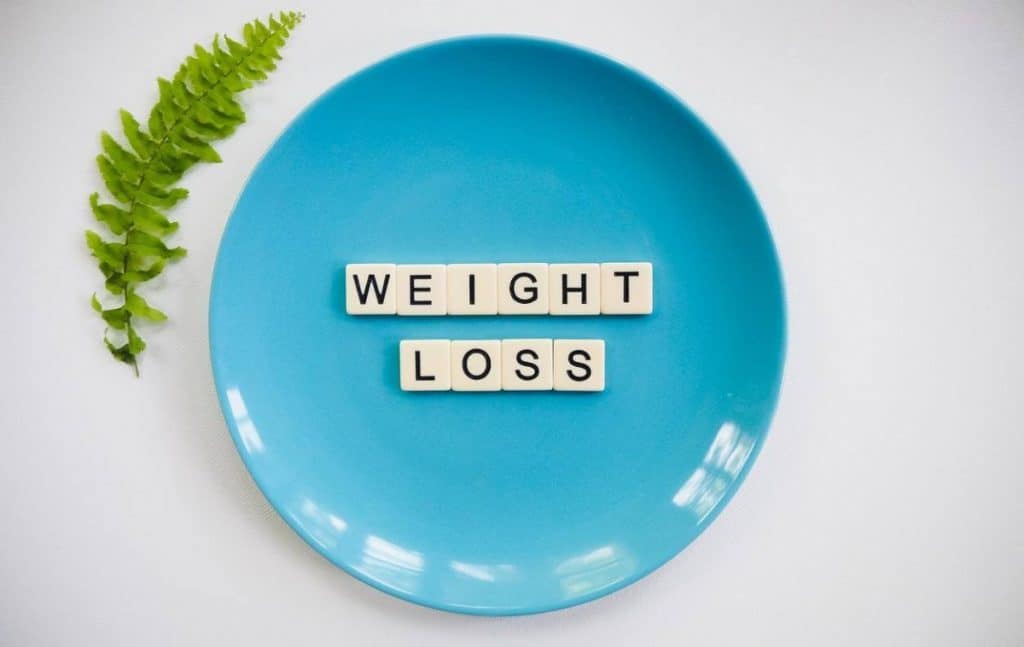 A plate having 'weight loss' written on it