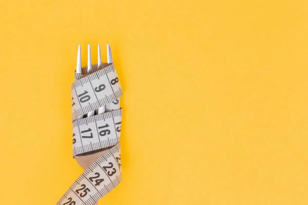 fork wrapped with a tape measure