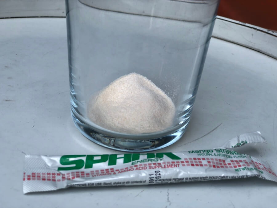 Spark stick pack powder emptied in a glass