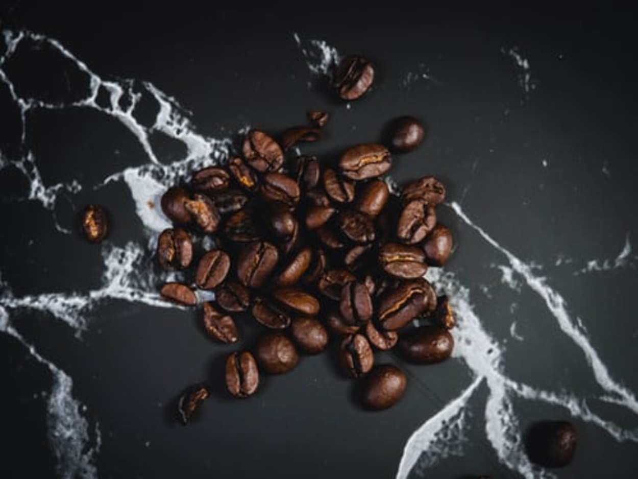 Coffee beans scattered on a surface