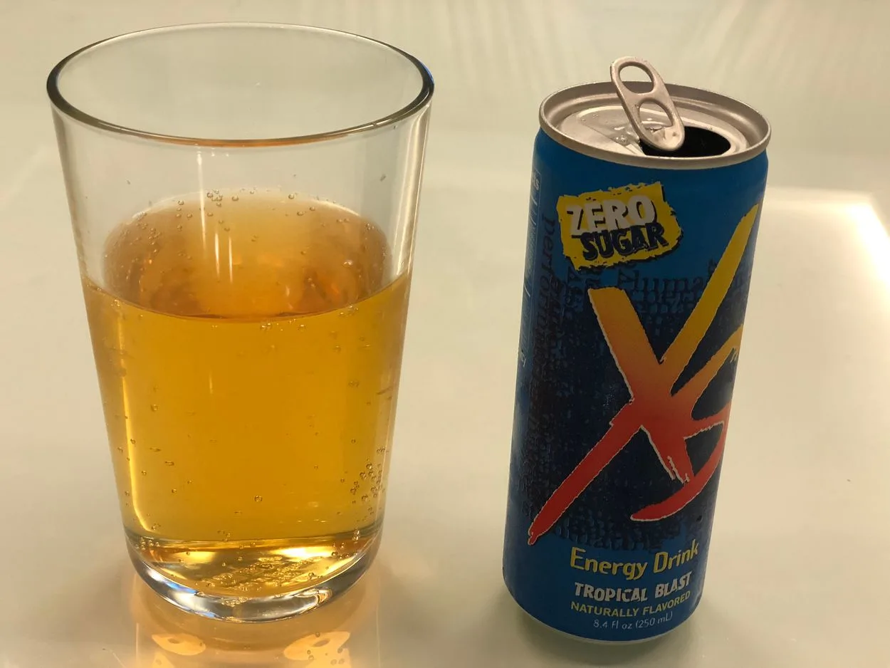 XS Energy drink can with glass