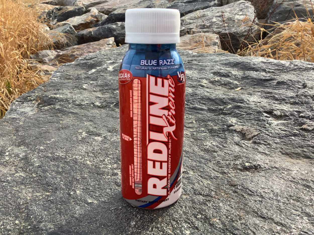A 4 ounce bottle of Redline Xtreme Energy in Blue Razz flavor