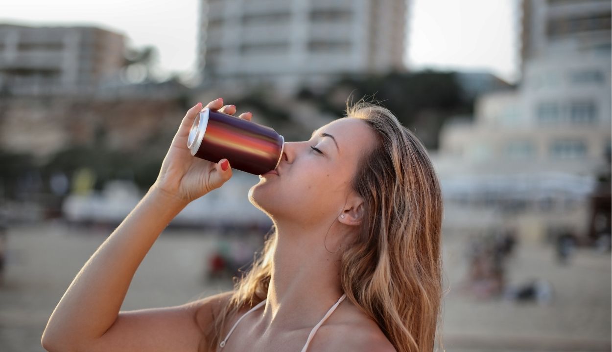 a girl drinking an energy drink 