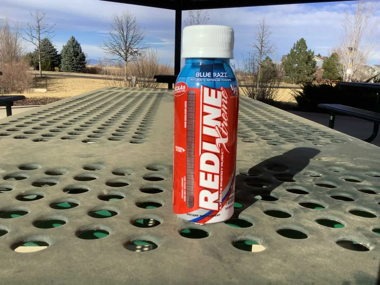 Bottle of Redline Xtreme Energy placed on the table