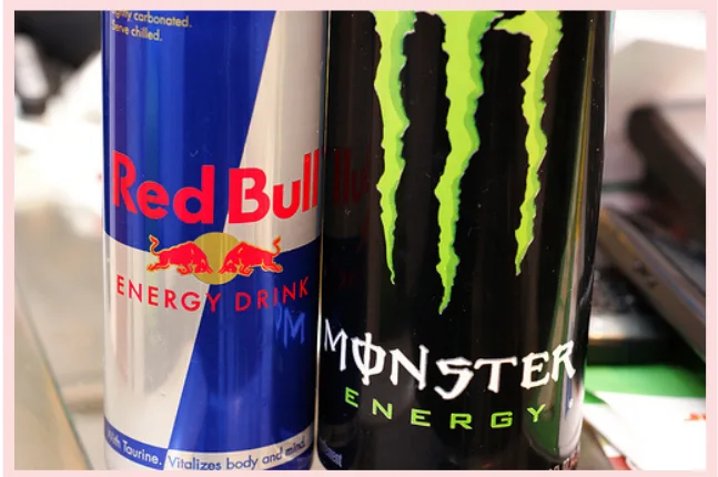 Cans of Redbull and Monster energy drinks