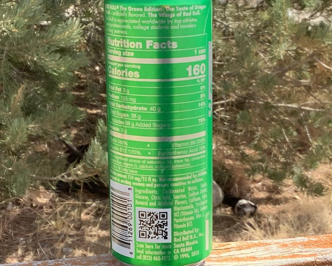 Back of the can of Red Bull green edition