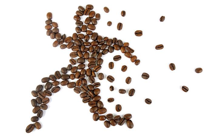 Coffee beans spread on a surface