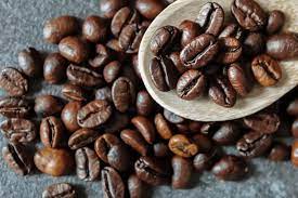 Coffee beans containing caffeine scattered on a surface
