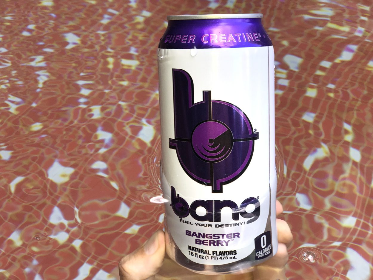 A person holding a can of Bang