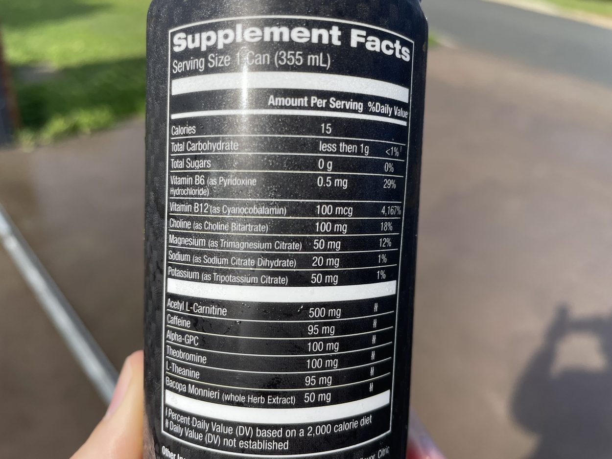 A person holding a can of Jocko Go and showing the nutritional facts