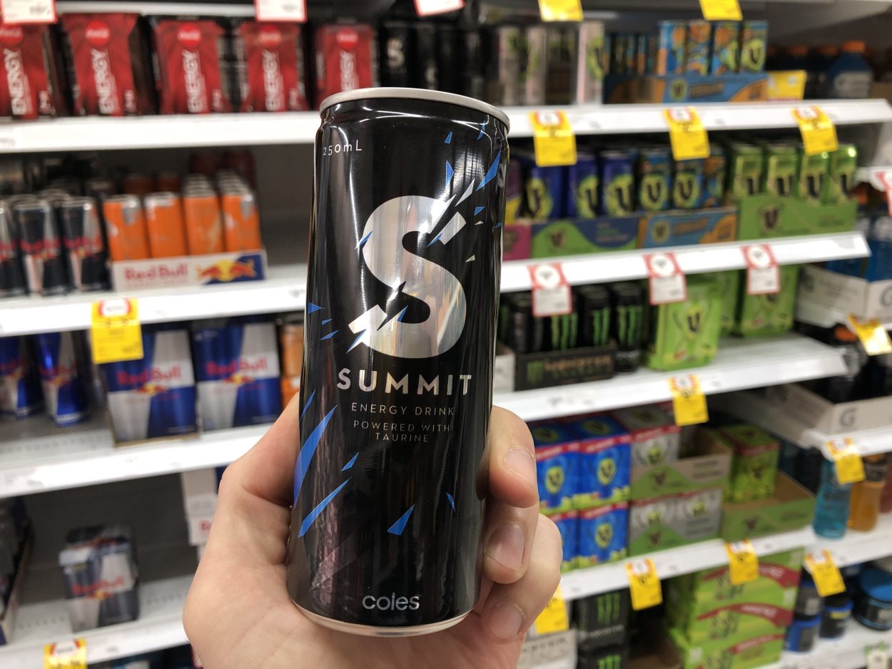 A person holding a can of Summit