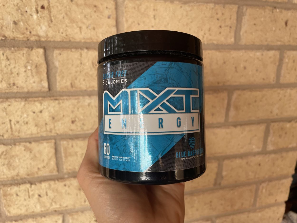 A person holding a tub of Mixt Energy