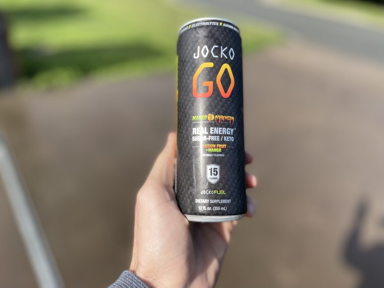 A person holding a can of Jocko Go