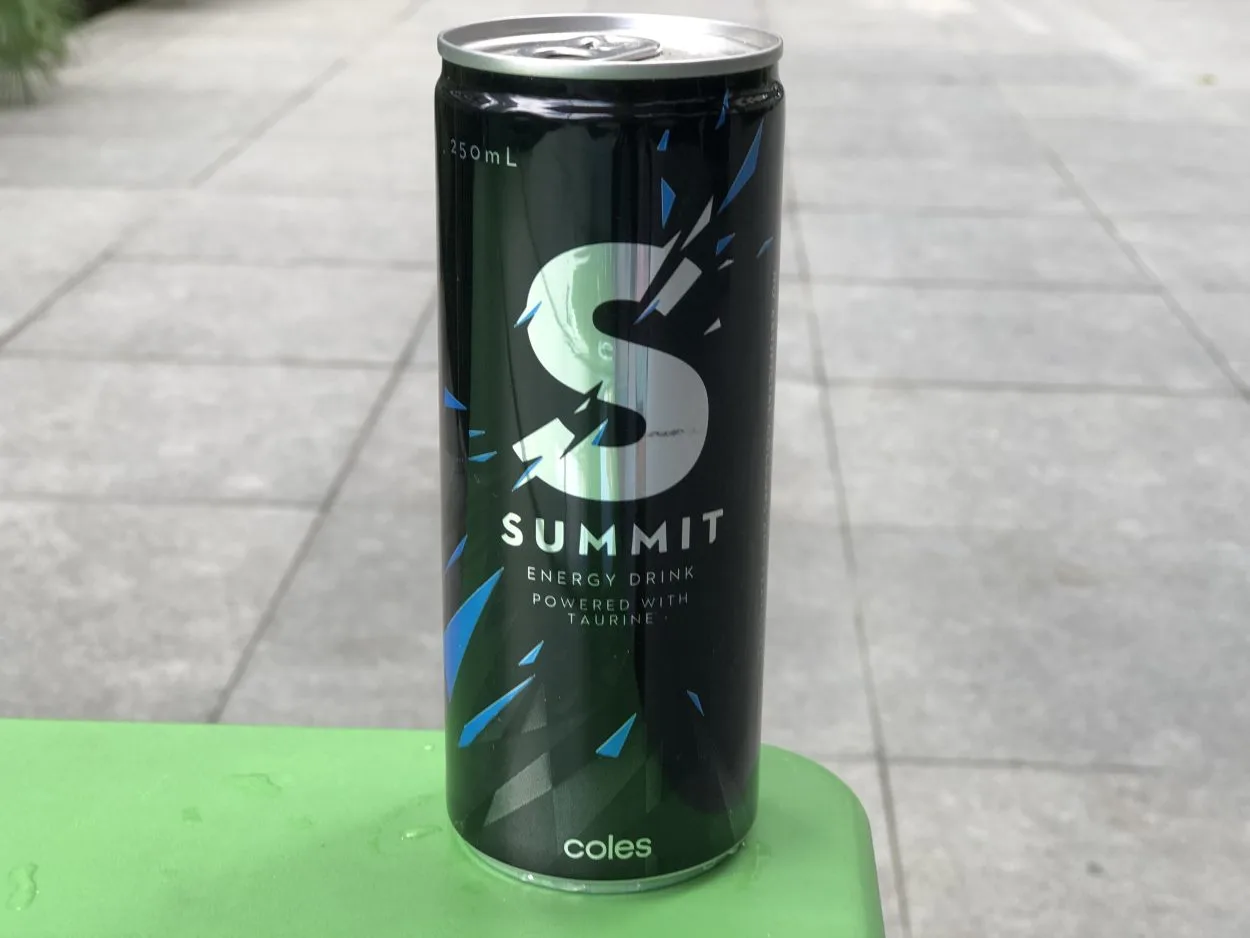 A can of Summit energy drink placed on green surface