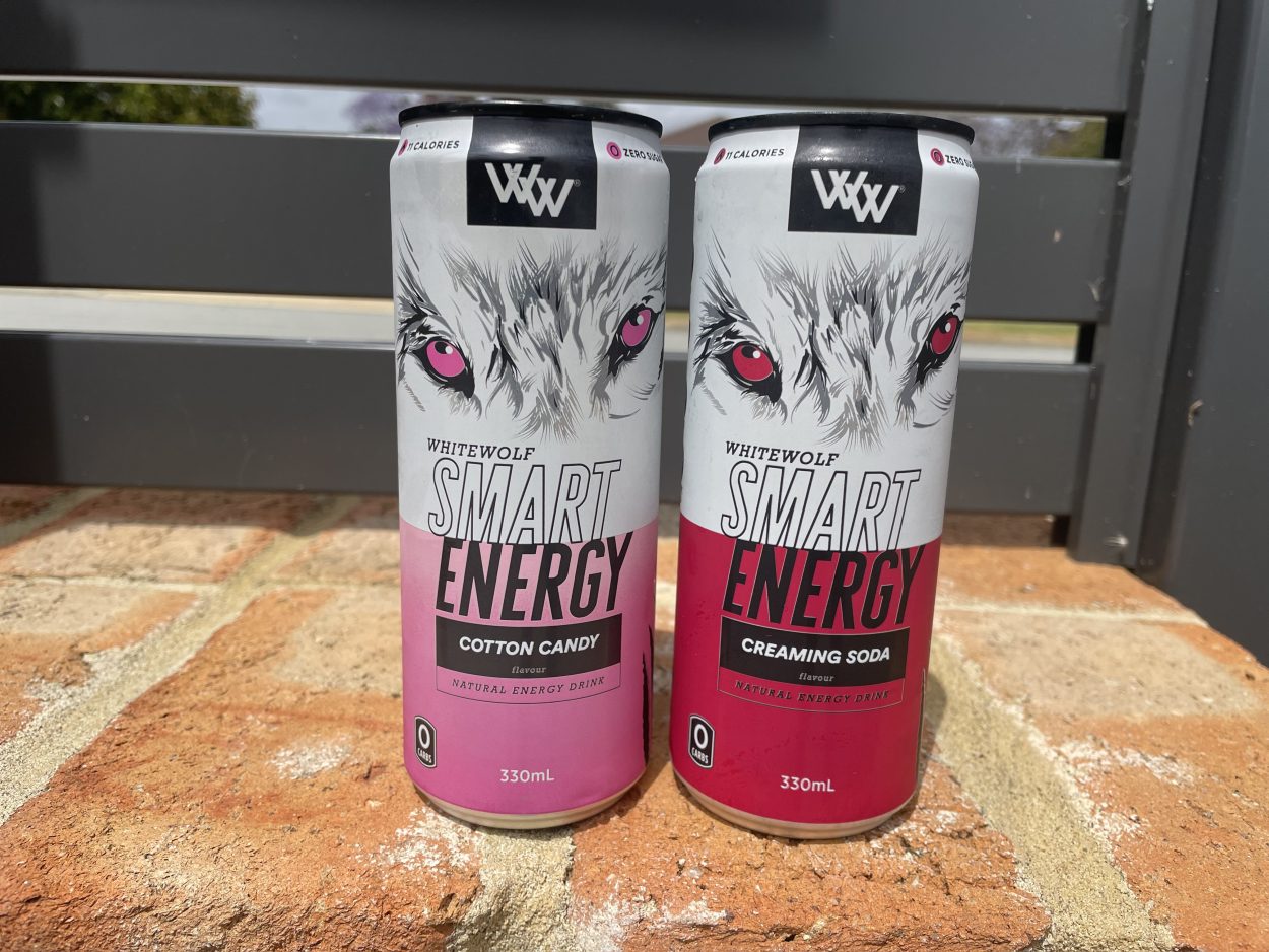Two cans of White Wolf Smart energy drinks in different flavors
