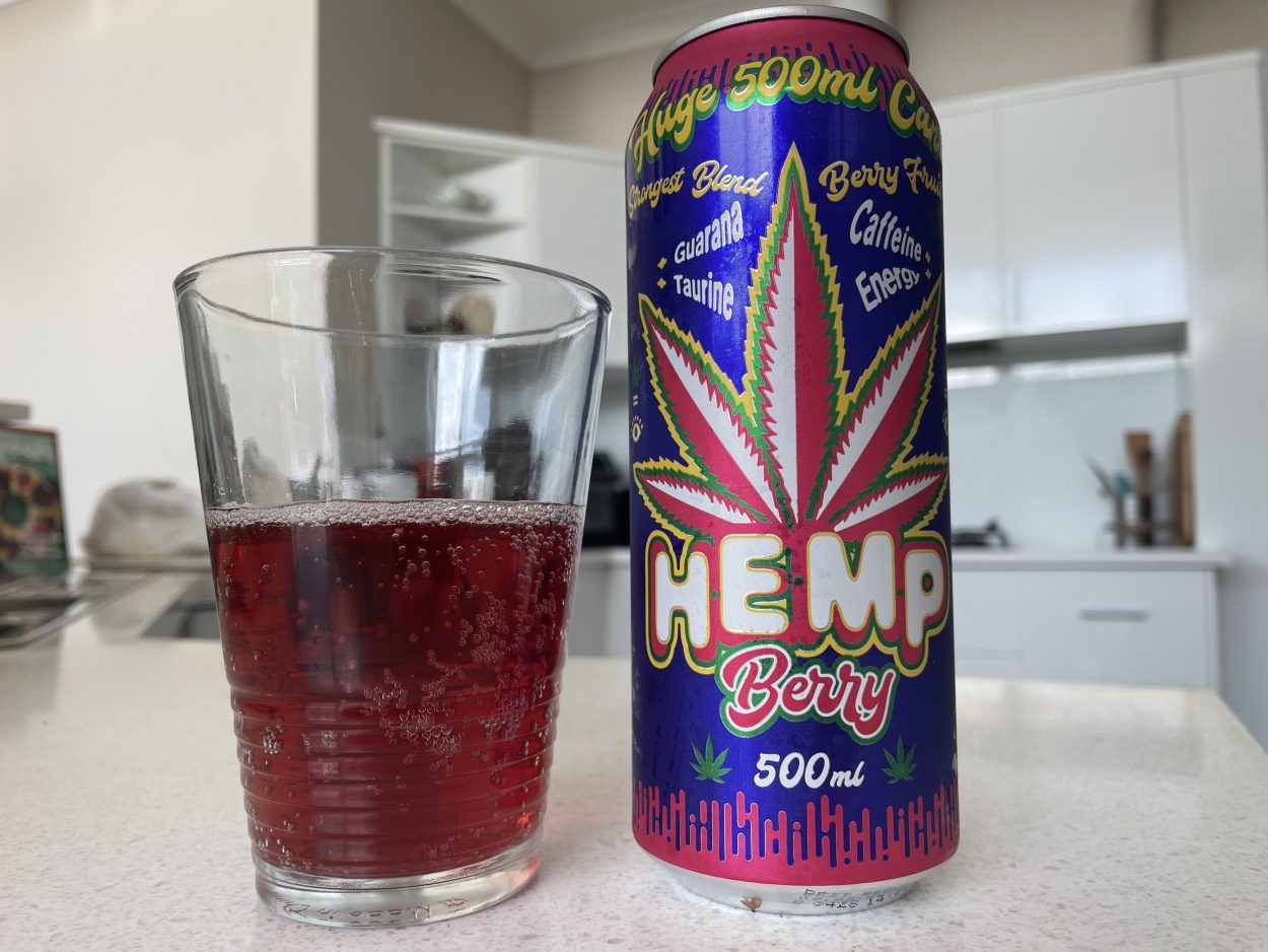 A can of Hemp Berry beside a glass filled with a serving of Hemp Berry